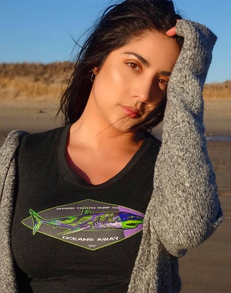 Artist Bianca DePaoli modeling the Oceans Away Tee in by Shark Tooth Surf Co. in collaboration with Bianca